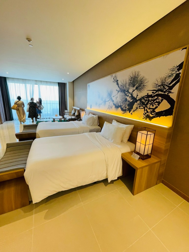 the twin beds at the Deluxe Ocean View Room at Da nang Mikazuki Japanese Resort & Spa