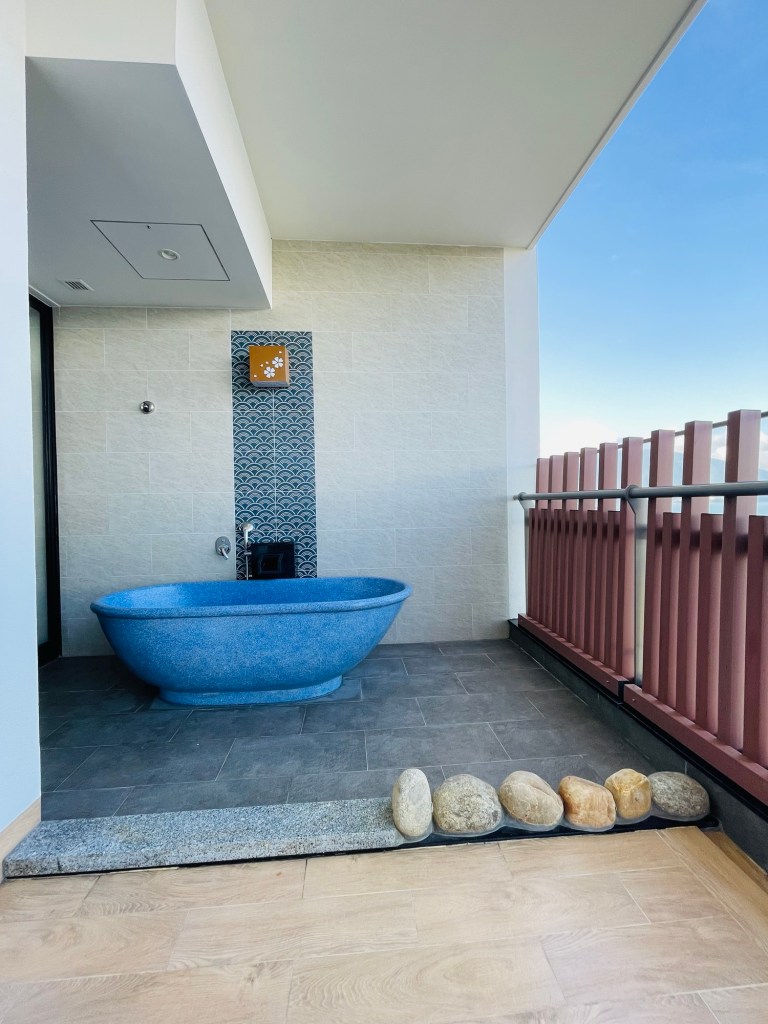 the outdoor tub at the Deluxe Ocean View room at Da nang Mikazuki Japanese Resort