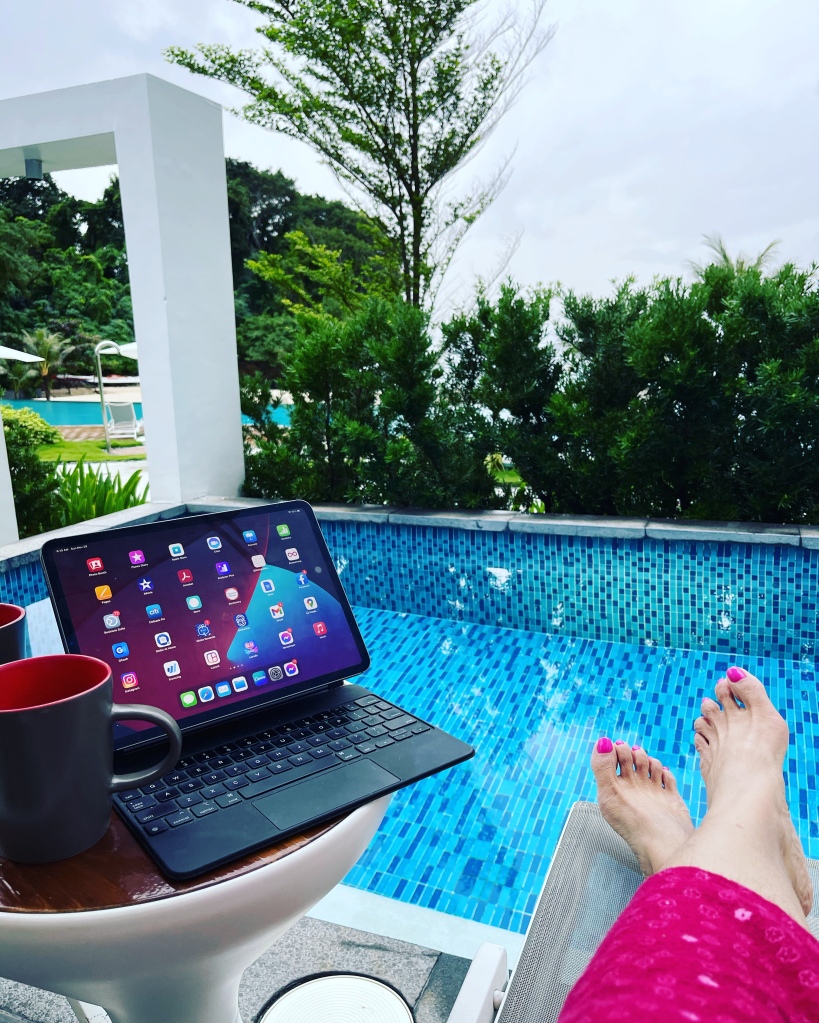 Working while enjoying the view of the pool and beach in the comfort of our own beachfront villa at Crimson Boracay