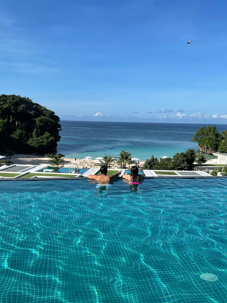 #TheBloggerPrincess enjoying the breathtaking view of Crimson Hotel Boracay's private beach in the Cobalt Pool.