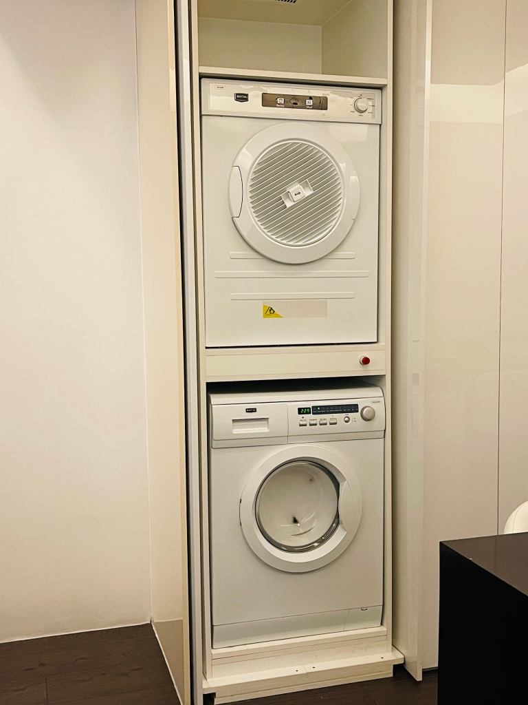 washing machine and dryer at the Alpha Suites