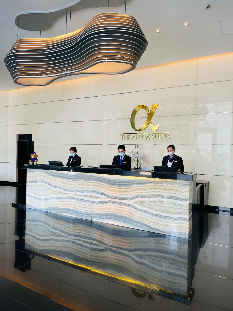 The reception staff of the Alpha Suites Makati